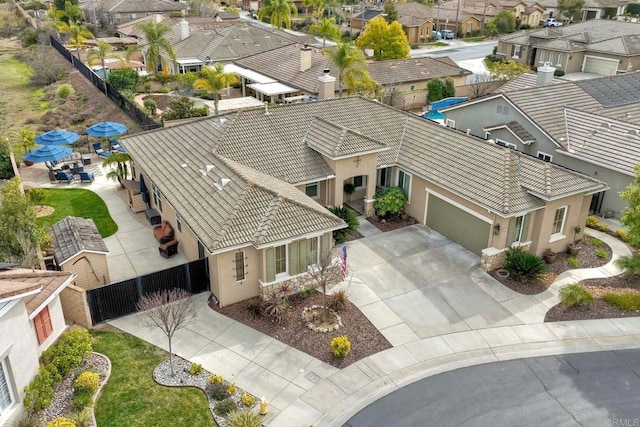 birds eye view of property with a residential view