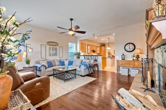 living room featuring ceiling fan, recessed lighting, visible vents, and wood-type flooring