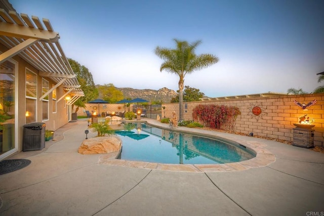 view of swimming pool featuring a patio, a fenced backyard, and a fenced in pool