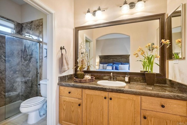 ensuite bathroom featuring ensuite bath, vanity, toilet, and a shower stall
