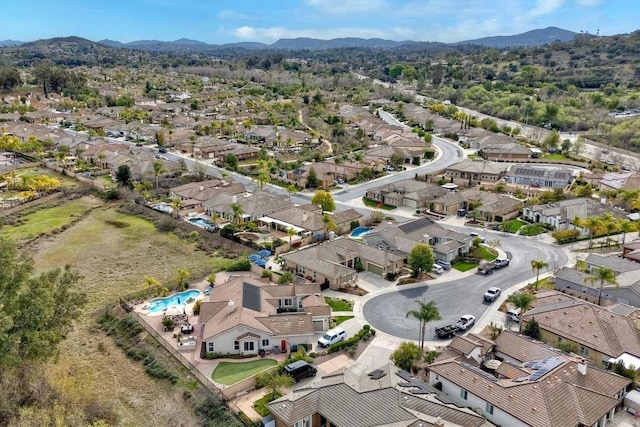 bird's eye view with a residential view and a mountain view