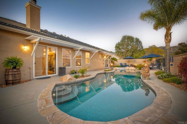view of swimming pool with a fenced in pool, a patio, and a fenced backyard