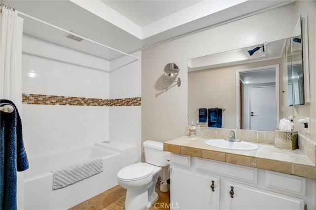 bathroom featuring toilet, visible vents, shower / tub combo with curtain, and vanity