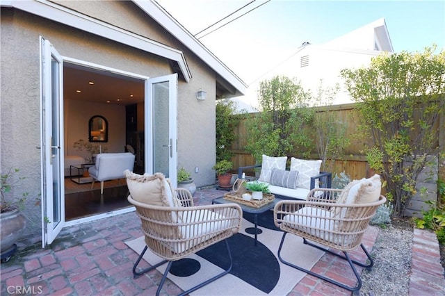 view of patio featuring a fenced backyard and an outdoor hangout area