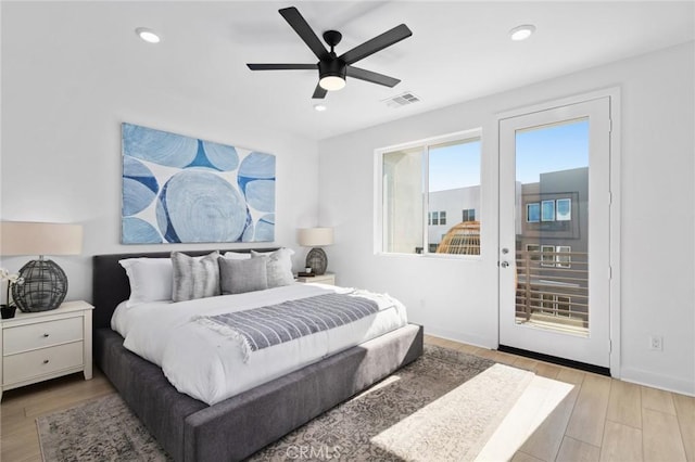 bedroom with recessed lighting, visible vents, access to exterior, baseboards, and light wood finished floors