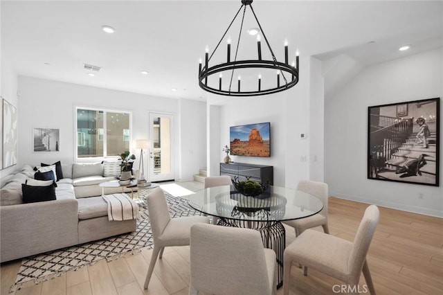 dining area with light wood-type flooring, baseboards, visible vents, and recessed lighting