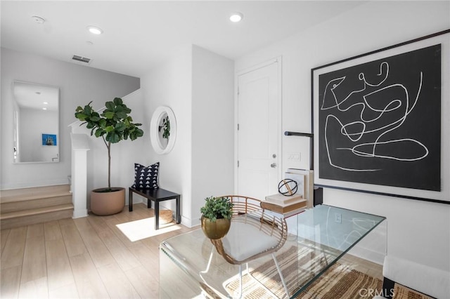 sitting room featuring baseboards, visible vents, wood finished floors, and recessed lighting