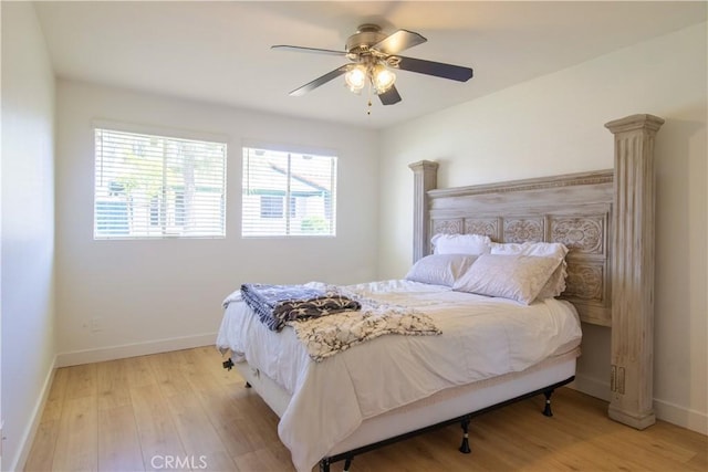 bedroom with ceiling fan, light wood-type flooring, and baseboards