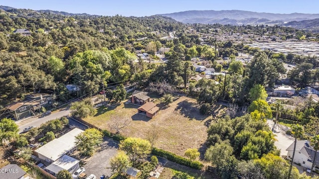 birds eye view of property featuring a mountain view