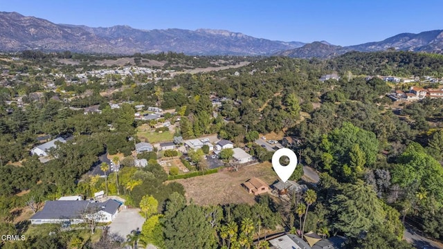 aerial view featuring a mountain view and a wooded view