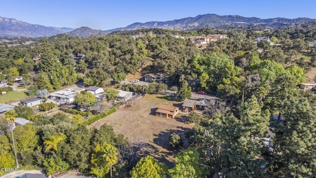 bird's eye view with a mountain view and a view of trees