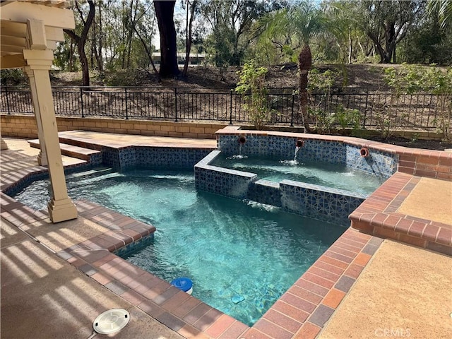 view of swimming pool featuring a fenced in pool, fence, and a jacuzzi