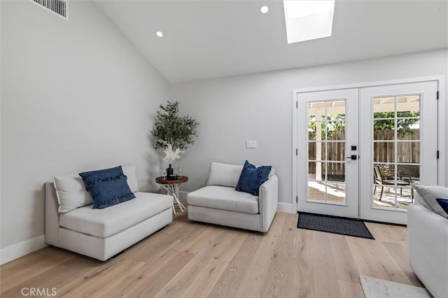 living area featuring french doors, recessed lighting, visible vents, light wood-type flooring, and baseboards