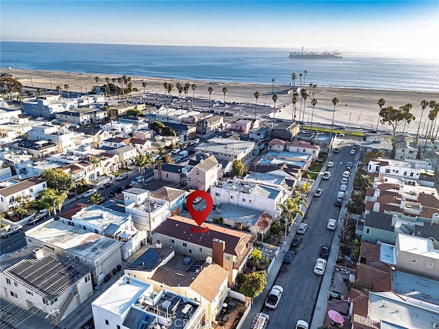 bird's eye view featuring a water view and a view of the beach