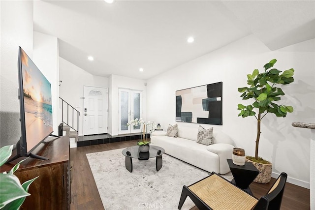 living room featuring stairs, dark wood-style flooring, baseboards, and recessed lighting