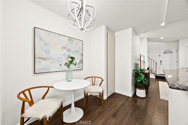 dining area featuring dark wood-style flooring, recessed lighting, stairway, an inviting chandelier, and baseboards