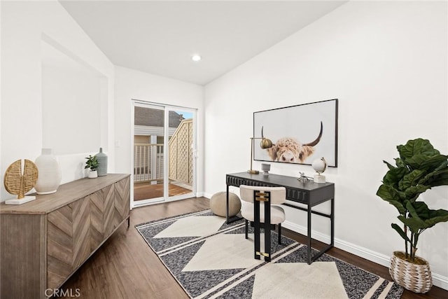 home office featuring lofted ceiling, recessed lighting, dark wood finished floors, and baseboards