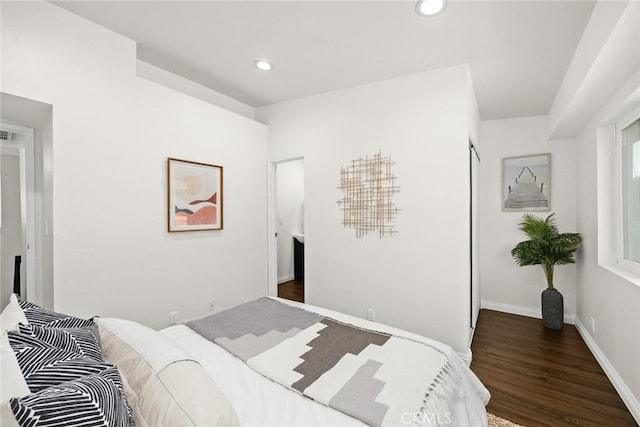 bedroom featuring baseboards, dark wood finished floors, and recessed lighting