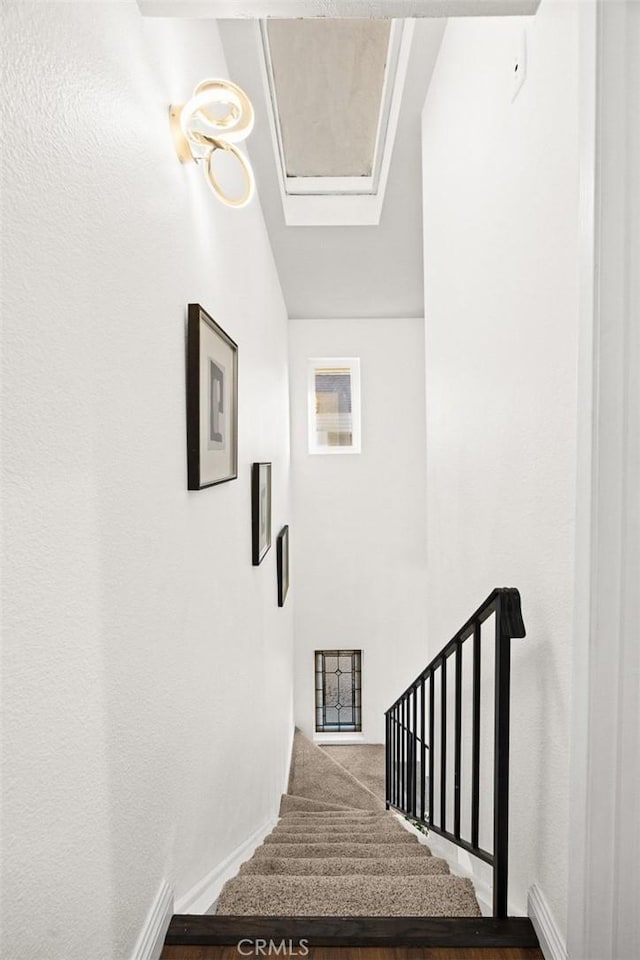 stairs featuring baseboards