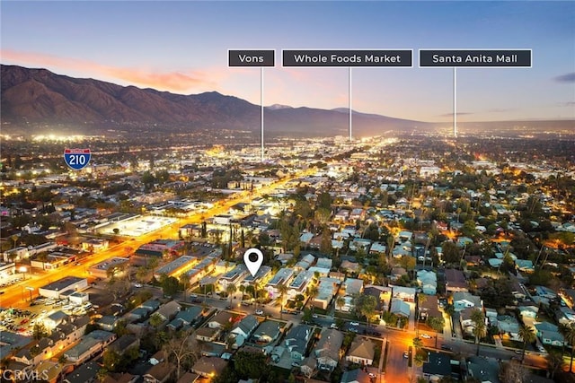 drone / aerial view featuring a mountain view