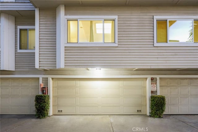 exterior space featuring concrete driveway