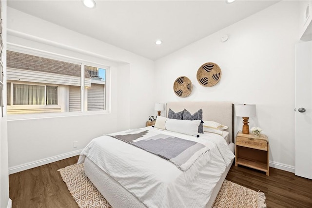 bedroom featuring recessed lighting, baseboards, and wood finished floors