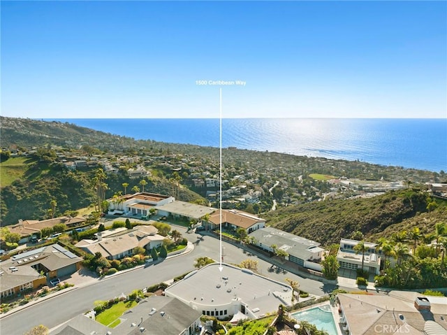 bird's eye view with a water view and a residential view