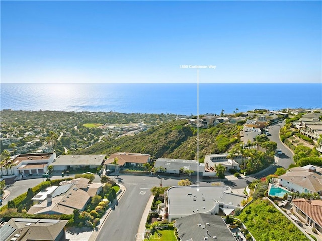 bird's eye view with a residential view and a water view