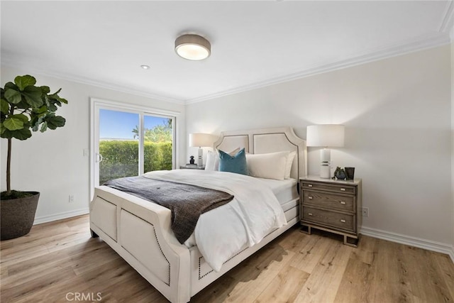 bedroom featuring access to exterior, light wood-style flooring, and ornamental molding