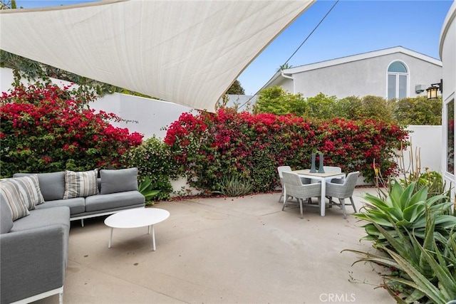 view of patio / terrace with outdoor dining space and an outdoor hangout area