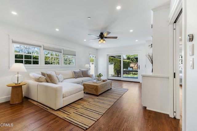 living area featuring recessed lighting, ceiling fan, baseboards, and wood finished floors