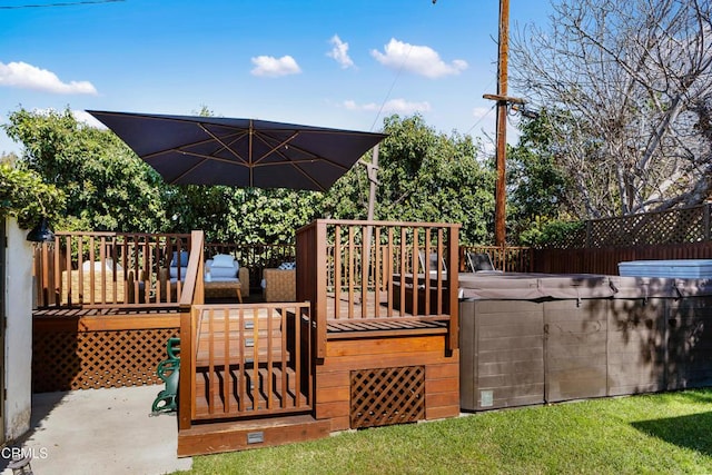 wooden deck with fence and a hot tub