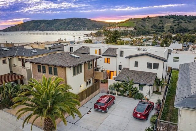 aerial view at dusk with a residential view and a mountain view