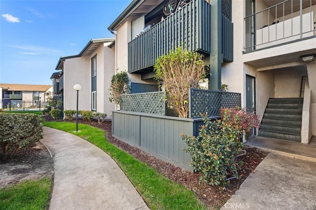 view of property exterior featuring a residential view and stucco siding