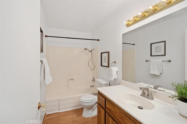 full bathroom featuring  shower combination, vanity, toilet, and wood finished floors