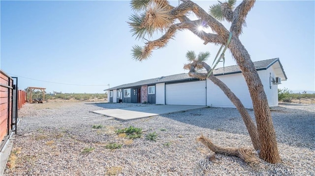 exterior space featuring driveway and an attached garage