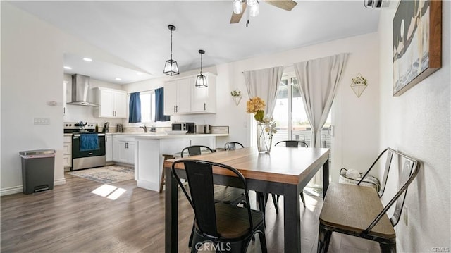 dining area featuring light wood-type flooring, ceiling fan, baseboards, and recessed lighting