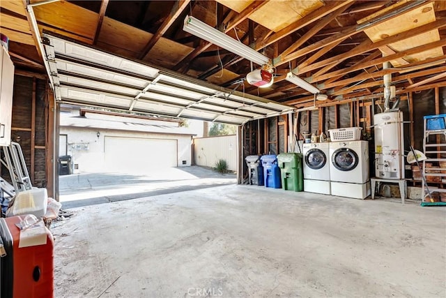 garage with separate washer and dryer, gas water heater, and a garage door opener