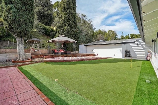 view of yard with a gazebo, a patio, and fence