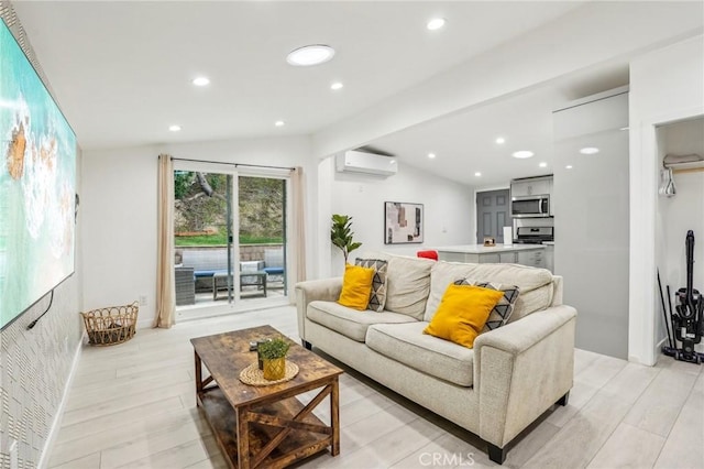 living room with recessed lighting, vaulted ceiling, light wood-style flooring, and a wall mounted AC