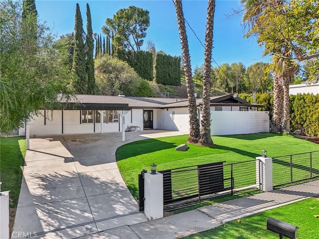 mid-century home with fence private yard, a gate, and a front lawn