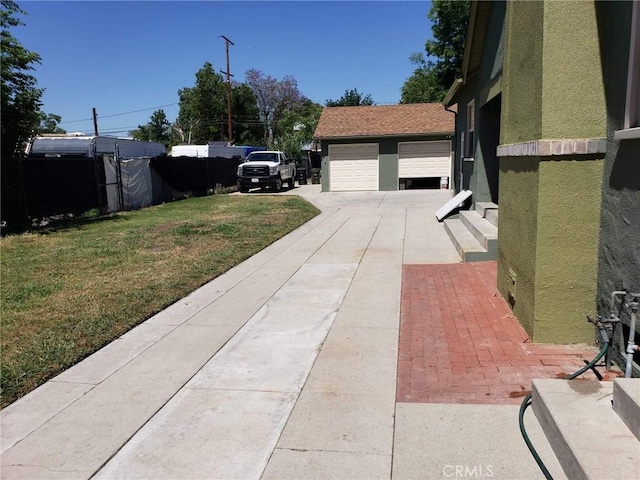 exterior space featuring a garage and an outdoor structure