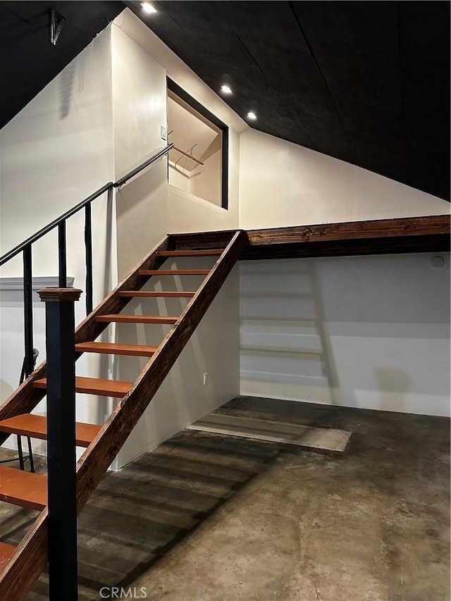 stairway with unfinished concrete floors