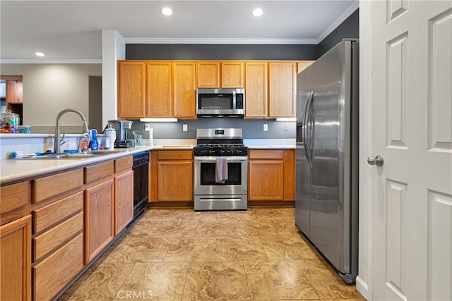 kitchen featuring ornamental molding, light countertops, appliances with stainless steel finishes, and a sink