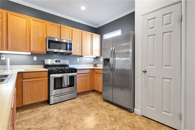 kitchen featuring appliances with stainless steel finishes, light countertops, and ornamental molding