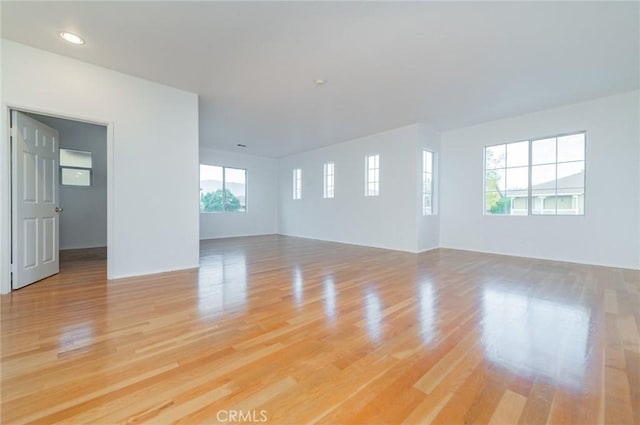 spare room with light wood-style floors