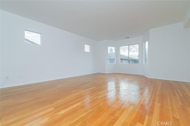 spare room featuring light wood-style flooring