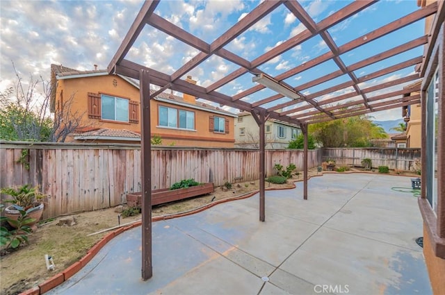 view of patio with a fenced backyard and a pergola