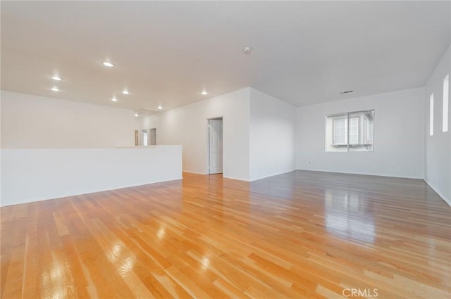 unfurnished room with recessed lighting and light wood-style floors