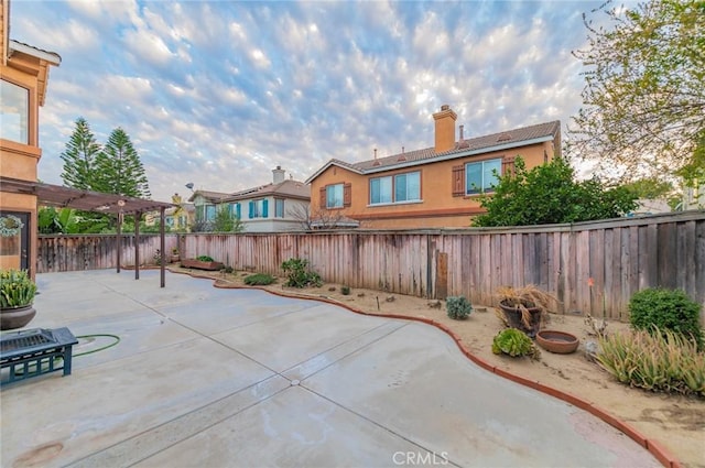 view of patio featuring a fenced backyard and a pergola